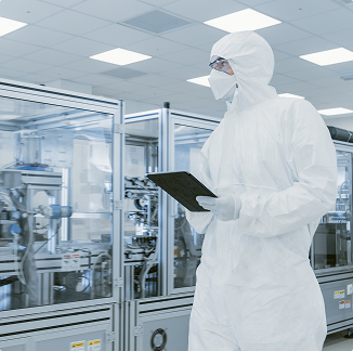 Cleanroom technician inspecting production equipment