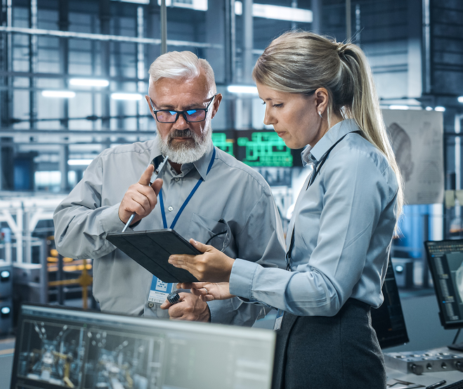 Engineering team reviewing manufacturing data